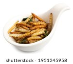 Deep Fried Bamboo Worms Caterpillar insects , crispy snack for eating, it is good source of protein and popular in Thailand served on white spoon isolated on white background.Clipping path