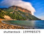 Small photo of Shot of Cap Canaille in Cassis covered by a hat shaped orographic stratus cloud