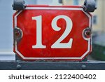 A Red Number Plaque  Showing...