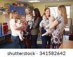 Small photo of Group Of Mothers With Babies Meeting At Playgroup