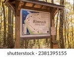 Small photo of Bradford, Pennsylvania, USA October 23. 2023 The Rimrock Hiking Trail in the Allegheny National Forest map on a sunny fall day