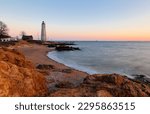 Beautiful sunset of New Haven Light House, Connecticut, USA. The lighthouse is dark, but the tower remains, greeting ships from around the world to New Haven. 