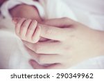 Soft focus of baby hands and mom, New family and baby protection concept
