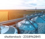 Small photo of Modern metal silos on agro-processing and manufacturing plant. Aerial view of Granary elevator processing drying cleaning and storage of agricultural products, flour, cereals and grain. Nobody.