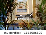 empty relaxing chair  nearby... | Shutterstock . vector #1933006802