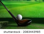 Sreen golf. Putter and golf ball on the background of the screen.
