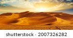 Small photo of Golden Sand Dune Desert Landscape Panorama. Beautiful sunset over the sand dunes in the Al Madam Desert, Sharjah, UAE.
