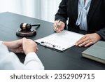 Male lawyer or counselor discussing negotiation legal case with client meeting with document contract in office, law and justice, attorney, lawsuit concept.