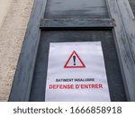 Small photo of Namur, Belgium - December 27 2019 : «Batiment insalubre, defense d’entrer», «Insanitary building, forbidden to enter» poster with a warning sign