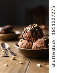 Small photo of Chocolate sorbet on the wooden background with space for text. Chocolate dessert. Chocolate ice cream