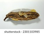 Small photo of roasted fish river lamprey (lampetra fluviatilis) on a bread