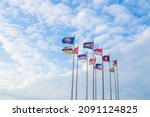 Small photo of The flags of the ten ASEAN countries represent freedom and see the sky with many white clouds, it can be used in work related to alliance and unity or in economic or political work.