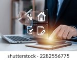 Businessman touching calculator for home loan concept, performance assessment and property value, contracts and percentage icons, loan amount, interest rate, loan term, mortgage, electronic signature.