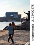Small photo of Stockholm, Sweden July 1, 2022 Dancers practive tango dancing on Riddarholmen near the water under a landmark statue of Evert Taube, a national troubadour.