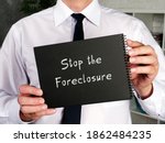 Small photo of Juridical concept about Stop the Foreclosure with inscription on the piece of paper.