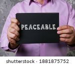 Small photo of PEACEABLE sign on the page.