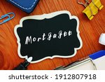 Small photo of Mortgagee sign on the piece of paper.