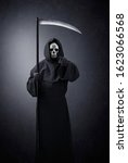 Small photo of Grim reaper pointing at you in the dark