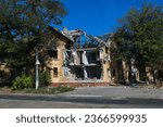 Small photo of A residential building was destroyed by an explosion as a result of Russia's war against Ukraine. A residential building damaged burned down from the consequences of the fighting in Mariupol.