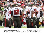 Small photo of Nov 14, 2021; Landover, MD USA; Tampa Bay Buccaneers quarterback Tom Brady (12) in a speaks in a huddle during an NFL game at FedEx Field. (Steve Jacobson, Image of Sport)