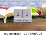 Small photo of December 29 on the wooden calendar.The twenty-ninth day of the winter month, a calendar for the workplace. Winter.