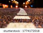 asphalt road leading into the city at night. Selective focus. background