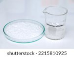 Small photo of Ammonium chloride in glass, chemical in the laboratory and industry, Chemicals used in the analysis