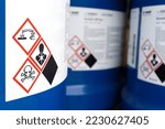 Small photo of Warning symbol on the chemical bottle , hazardous chemicals in the industry