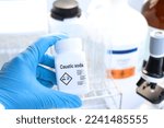 Small photo of caustic soda in bottle , chemical in the laboratory and industry, Chemicals used in the analysis
