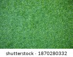 Top view and close up shot of long grass lawn which is in garden and sport stadium (soccer, baseball and football) is suit beautiful greenery background and wallpaper for environmental and sport idea.