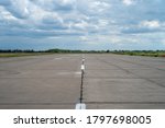 Military transport airfield Kryvyi Rih. Empty runway strip and cumulus.