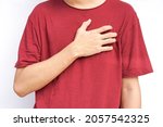 Small photo of a young man hands holds his left chest, chest pain concept from Myocarditis or pericarditis caused by immune system,bacteria or viruses infection ,vaccination