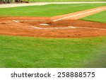 Small photo of home plate and batters box at a baseball field