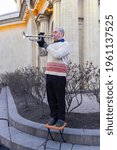 Small photo of Saint Petersburg-Russia-14.09.2020: Street musician Mikhail Tyumentsev. A musician named Uncle Misha plays the trumpet.