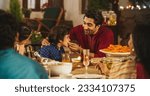 Small photo of Family Time and Good Happy Memories: Indian Father Feeding his Son and Sharing Traditional Food on a Family Dinner. Family Bonding Memories Full of Love and Affection