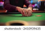 Small photo of Close Up On Hands Of Professional Poker Dealer Doing A Riffle Shuffle Of Playing Cards Before High Stakes Game In Luxurious Casino. Anonymous Croupier Shuffling Deck Before Competitive Tournament.