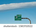 Small photo of Traffic sign under stratus clouds
