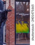 Small photo of Toronto, OntarioCanada-November 30, 2023 - The sculpture 'Chorus' by Sylvia Lefkovitz is outside of the art gallery showcasing the painting by Rita Letendre in Yorkville Village.
