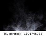 Close-up view of white water vapor with spray from the humidifier. Isolated on black background