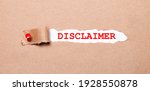 Small photo of Beneath the torn strip of kraft paper attached with a red button is a white paper labeled DISCLAIMER