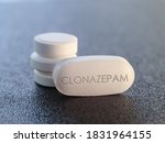 Small photo of Clonazepam Drug Medication tablet used to treat seizures panic disorder and movement disorder, akathisia. Benzodiazepine sedative Pill for epilepsy