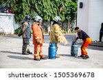 Small photo of Firemen using extinguisher and water for fight fire during firef. September12, 2019 Nakhon Ratchasima, Thailand