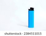 Blue plastic lighter on white...