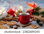 Christmas mood, holiday atmosphere. Red cup of coffee, Christmas gift boxes, Christmas tree golden ball, cones, star anise, cinnamon on a wooden windowsill.