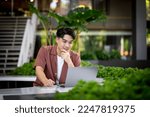 asian  man in casual dress working in outdoor office. Concept for working and open office.