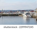 Small photo of Sopot, Poland - 01 19 2020: embankment and view of the pier in the resort town of Sopot, a pier in winter time, the famous Sopot pier, a pleasure boat at the pier