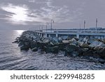 Small photo of Sopot, Poland - 01 19 2020: embankment and view of the pier in the resort town of Sopot, a pier in winter, the famous Sopot pier, a ridge of stones near the pier