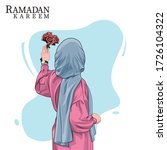 hijab girl holding flowers on...
