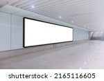 Horizontal long mock up of blank advertising billboard poster template in a long tunnel walkway; out-of-home OOH media display space mockup in pedestrian underpass; digital display