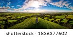 Small photo of Glastonbury Tor near Glastonbury in the English county of Somerset, topped by the roofless St Michael's Tower, UK